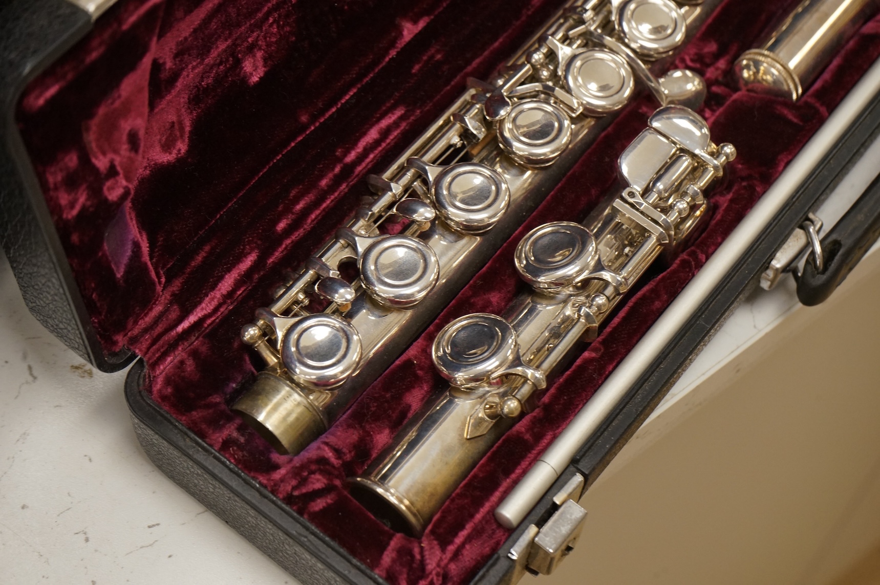 Three musical instruments to include a Buffet flute and violin with two bows